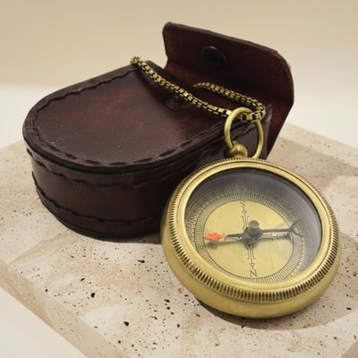 Stylish brass compass with chain in a leather case