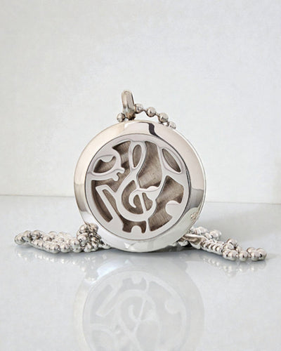 Symfonia Zapachu – Aromaterapeutyczny Naszyjnik z Motywem Nut Muzycznych 25 mm